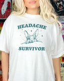 Woman wearing a white 'Headache Survivor' shirt featuring a funny rabbit with a headache graphic.