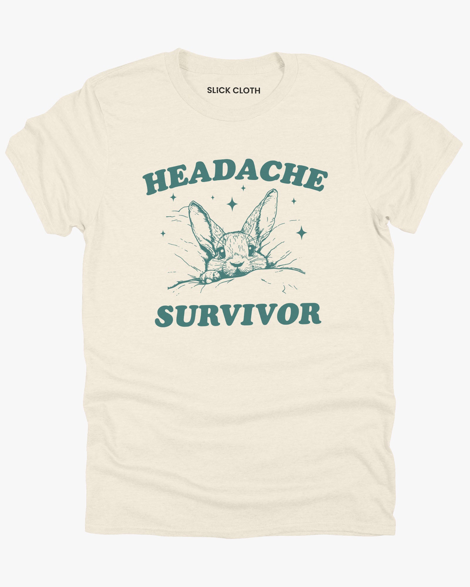 Flat laying natural beige color 'Headache Survivor' shirt featuring a funny retro bunny with a headache graphic.
