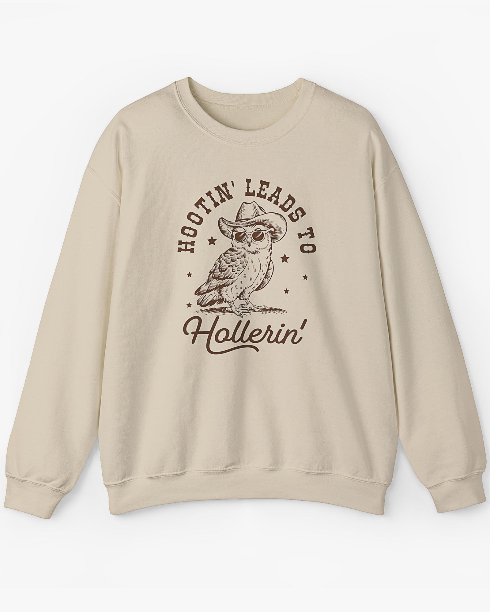 Flat laying sand beige 'Hootin Leads To Hollerin' sweatshirt with funny retro owl graphic