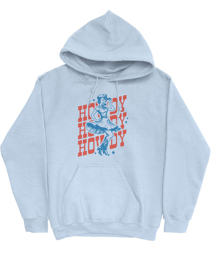 Flat lay of a light blue hoodie with a retro howdy cowgirl graphic.