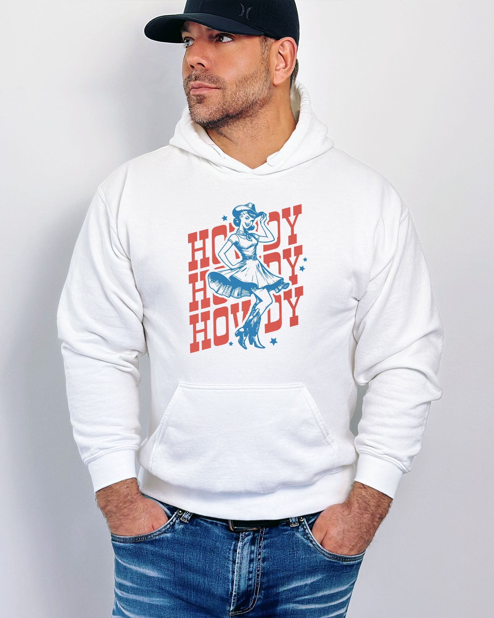 Man wearing a white hoodie with a retro howdy cowgirl graphic.