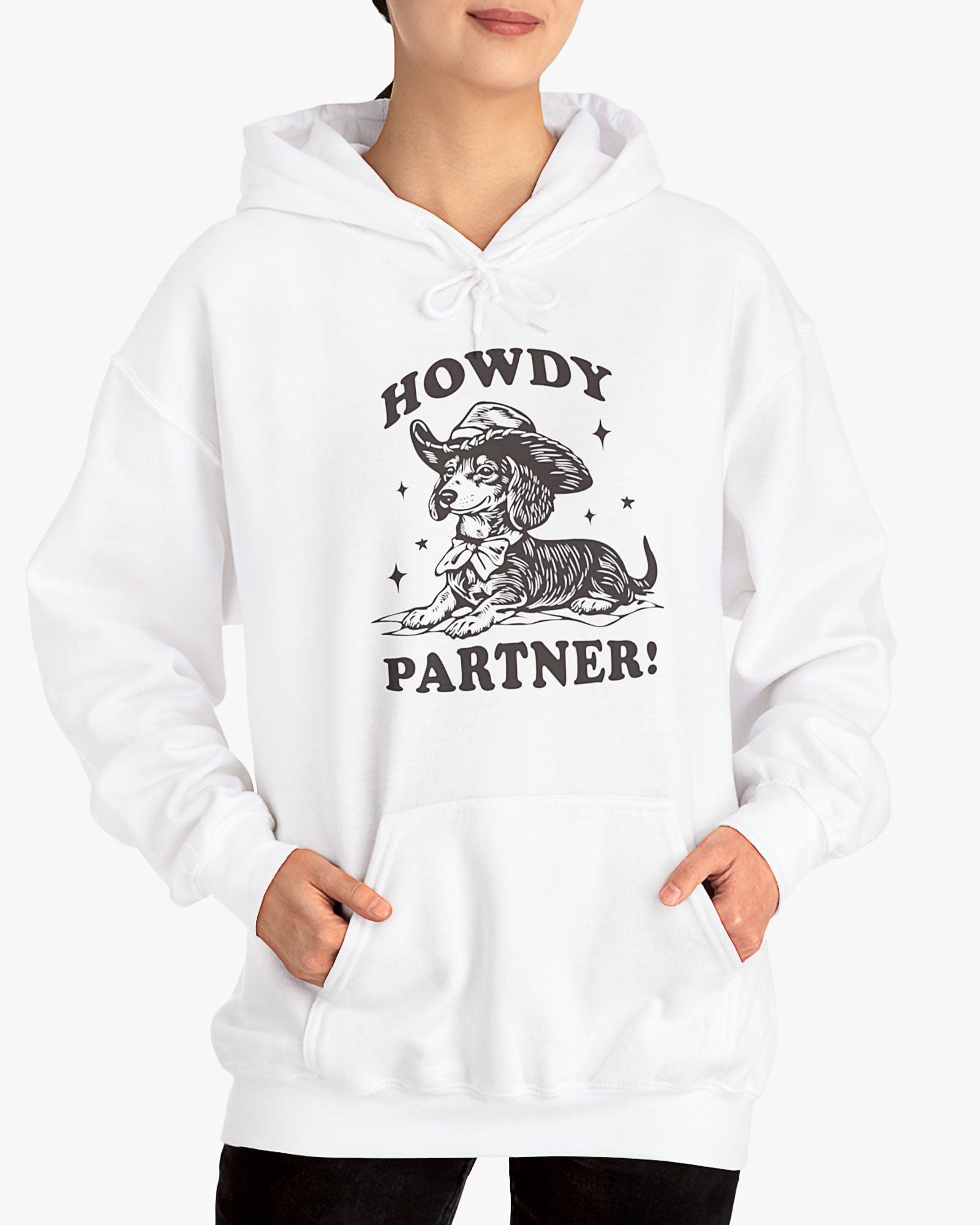 Woman wearing white 'Howdy Partner' hoodie with funny retro cowboy dachshund graphic