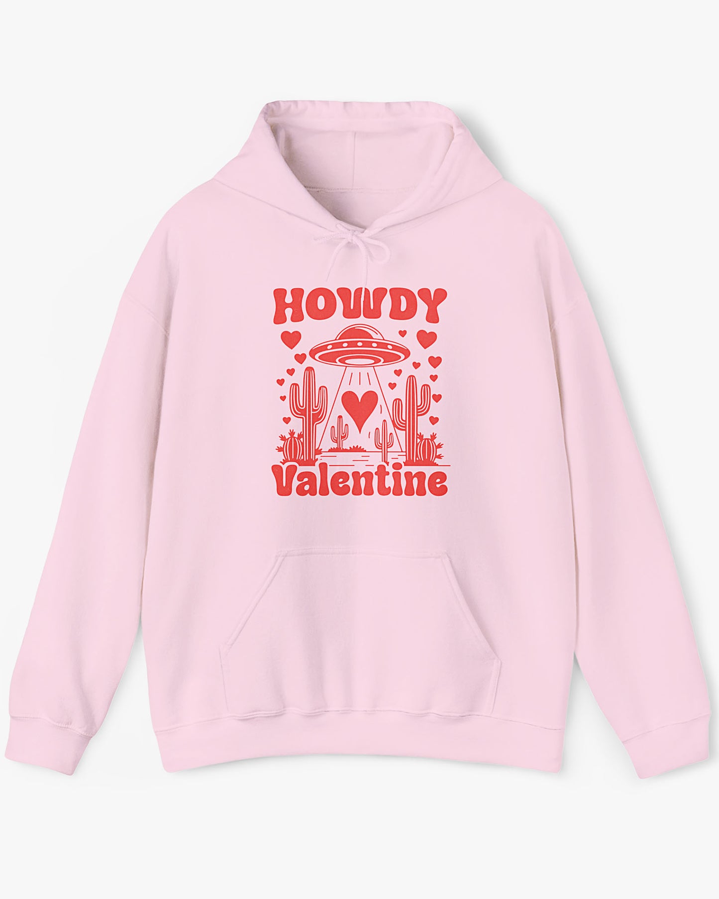 Flat lay light pink Howdy Valentine hoodie featuring a retro western desert scene with a UFO and floating hearts graphic.