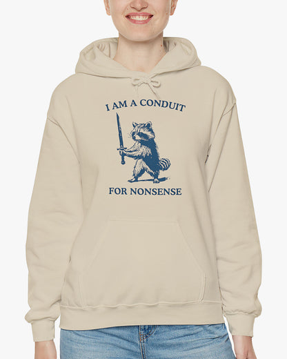 Woman wearing a sand beige 'I Am A Conduit For Nonsense' hoodie with a funny retro raccoon holding a sword graphic