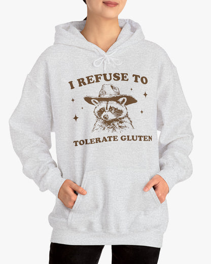 Woman wearing an 'I Refuse To Tolerate Gluten' hoodie in ash gray, featuring a retro western graphic design and unisex fit.