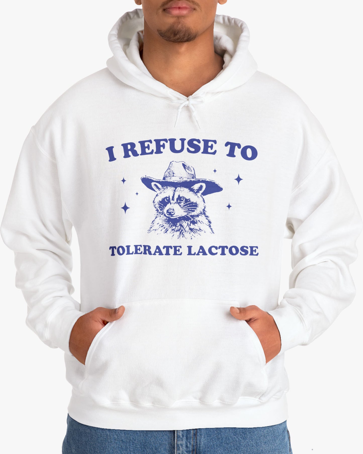 Man wearing an 'I Refuse To Tolerate Lactose' shirt in white, featuring a retro cowboy raccoon graphic design and unisex fit.