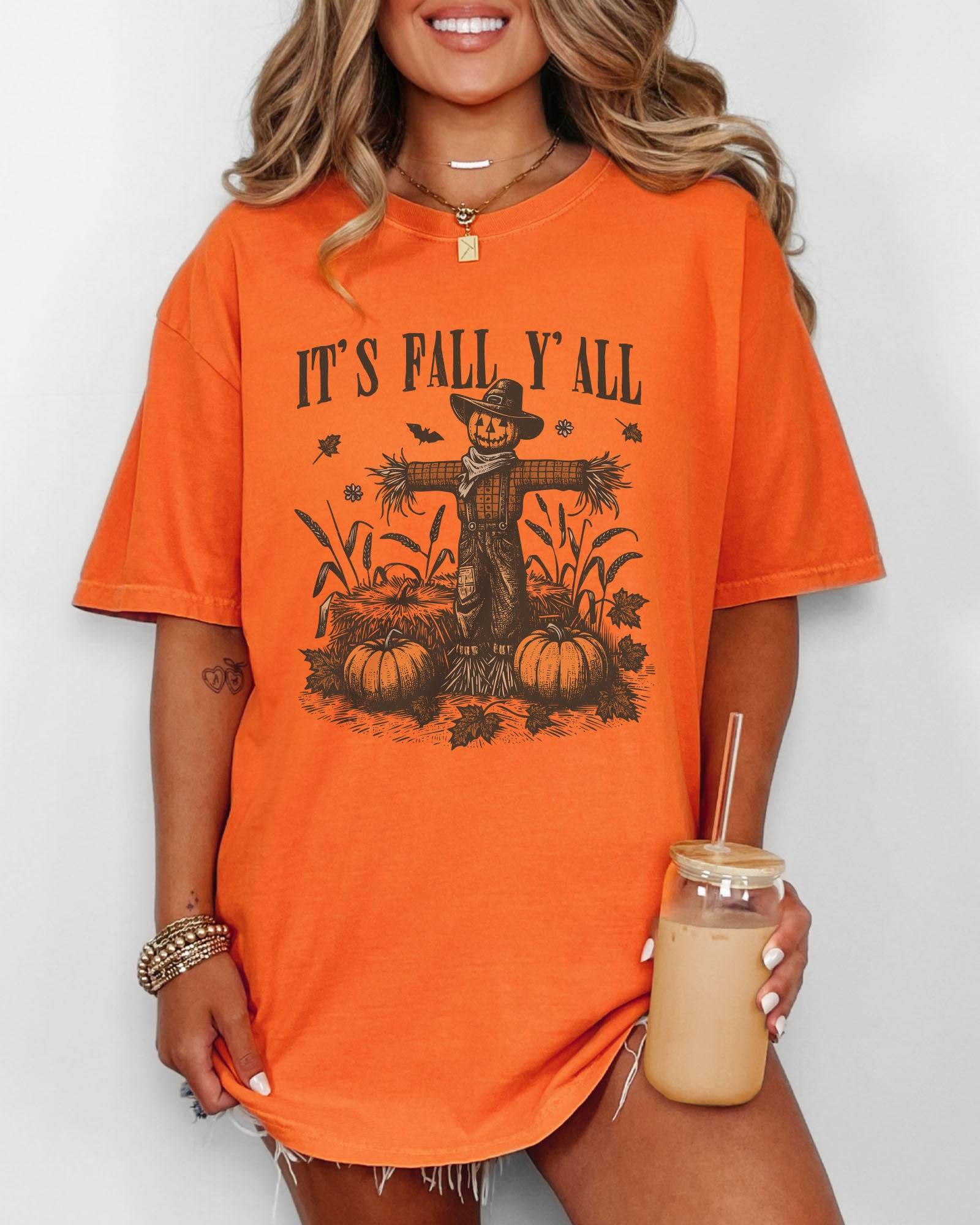 Model wearing burnt orange color shirt with 'It's Fall Y'all' graphic design