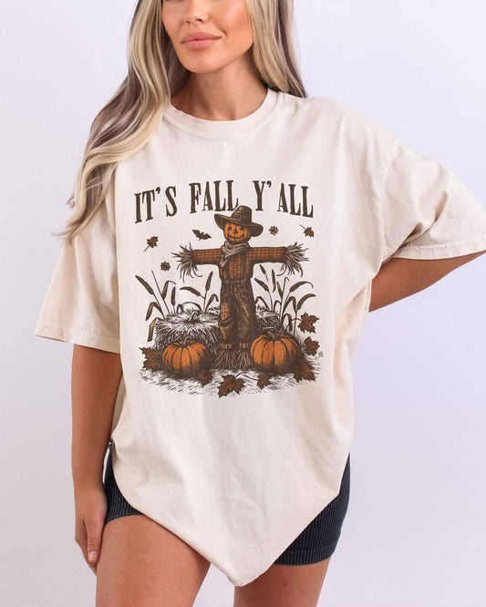 Model wearing ivory color shirt with 'It's Fall Y'all' graphic design