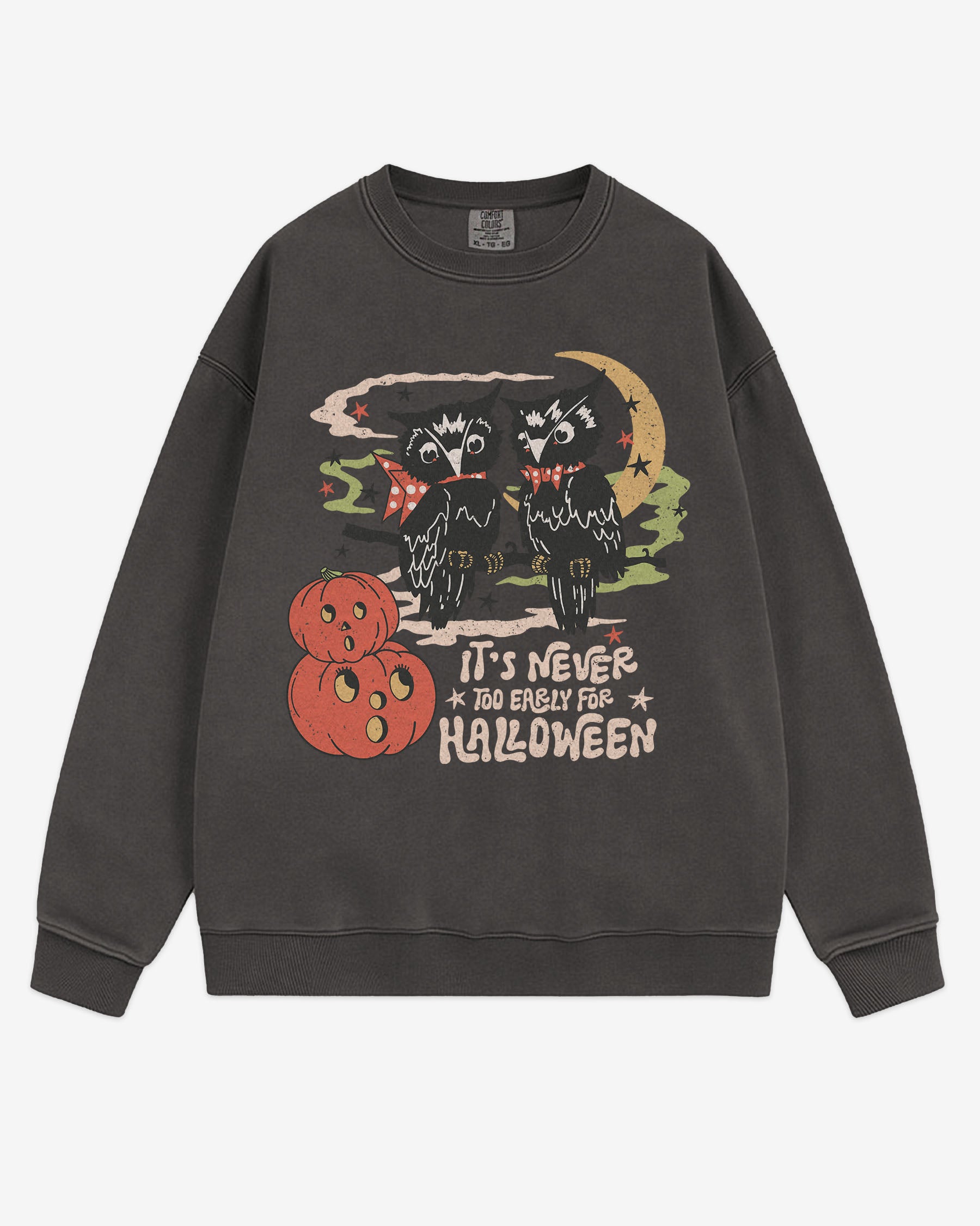 Flat lay pepper ‘It’s Never Too Early For Halloween’ sweatshirt with retro graphic of two owls, pumpkins, and night sky.