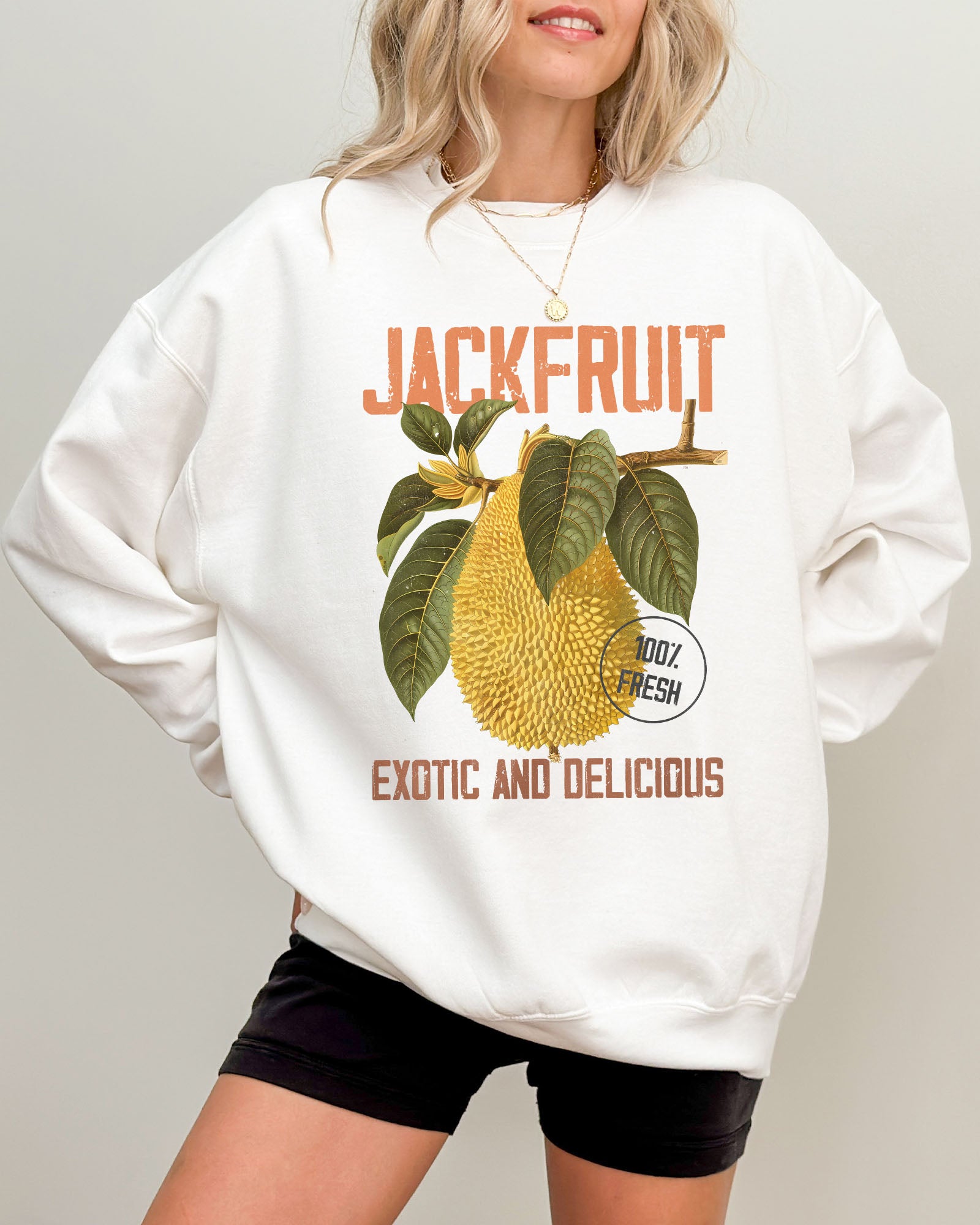 Model wearing white color sweatshirt with jackfruit retro graphic design