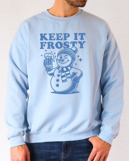Model wearing light blue color sweatshirt with 'Keep It Frosty' snowman graphic design