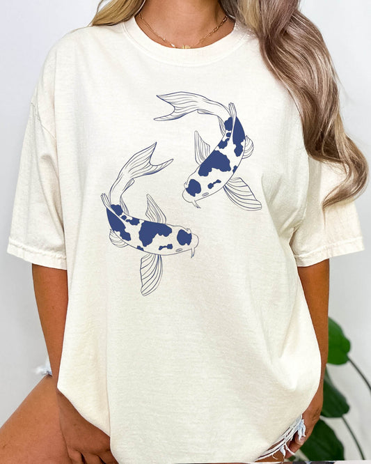 Woman wearing retro japanese graphic Koi Fish shirt in natural beige color