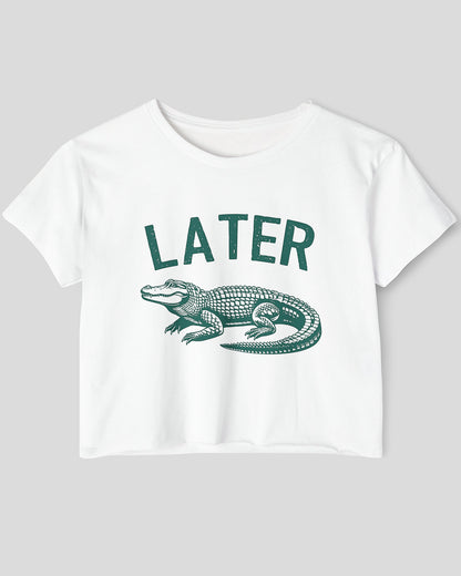 Flat lay white-colored 'Later Gator' crop top featuring a funny retro alligator graphic.
