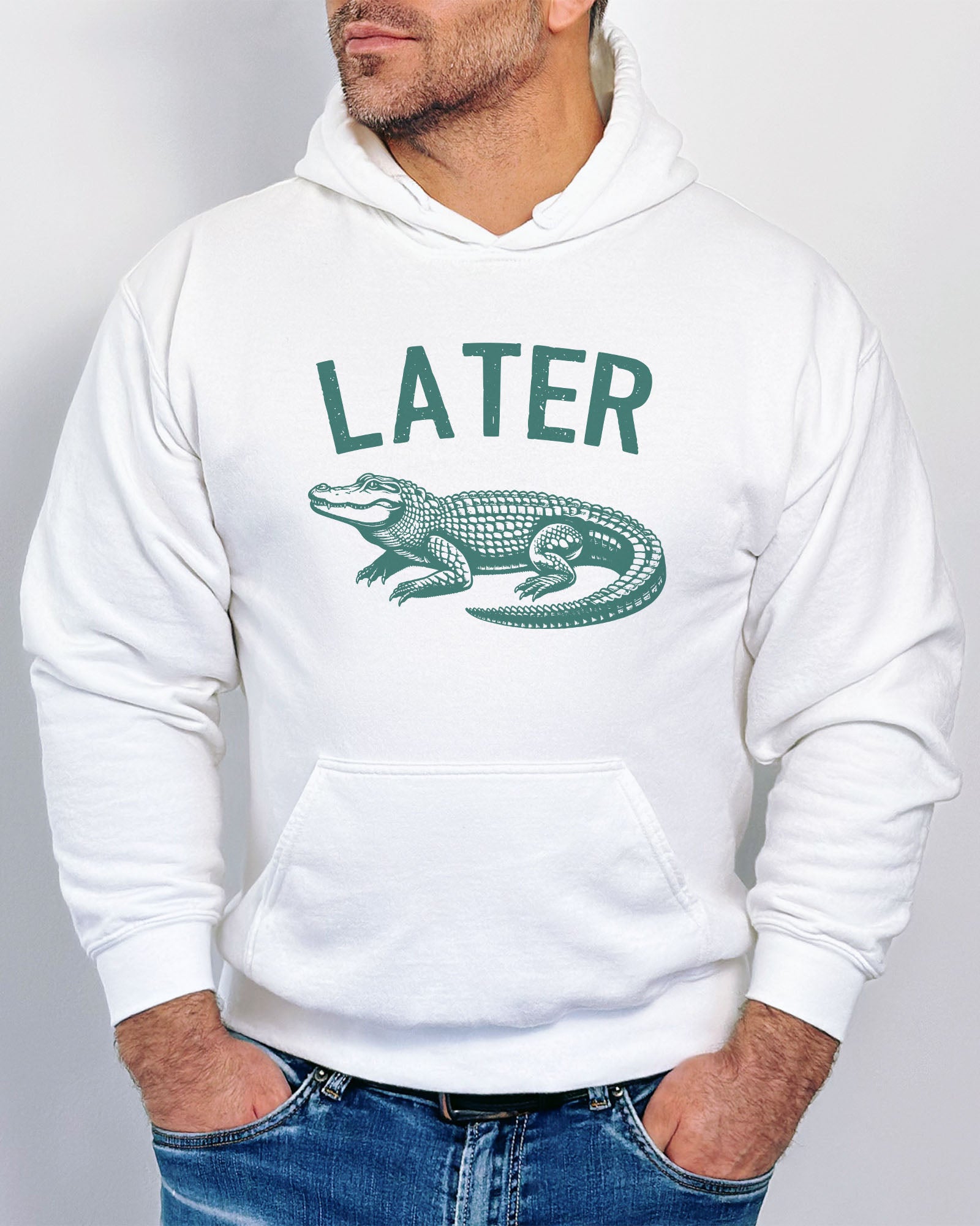 Man wearing a white colored 'Later Gator' hoodie featuring a funny retro alligator graphic.