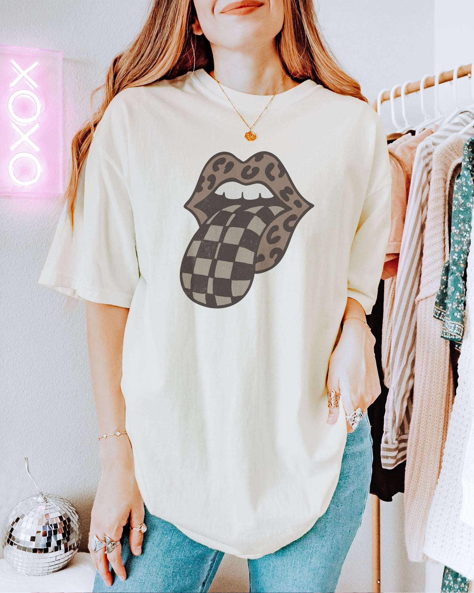 Model wearing ivory color shirt with 'Leopard Mouth Checkered Tongue' graphic design