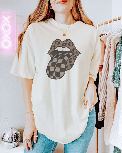 Model wearing ivory color shirt with 'Leopard Mouth Checkered Tongue' graphic design