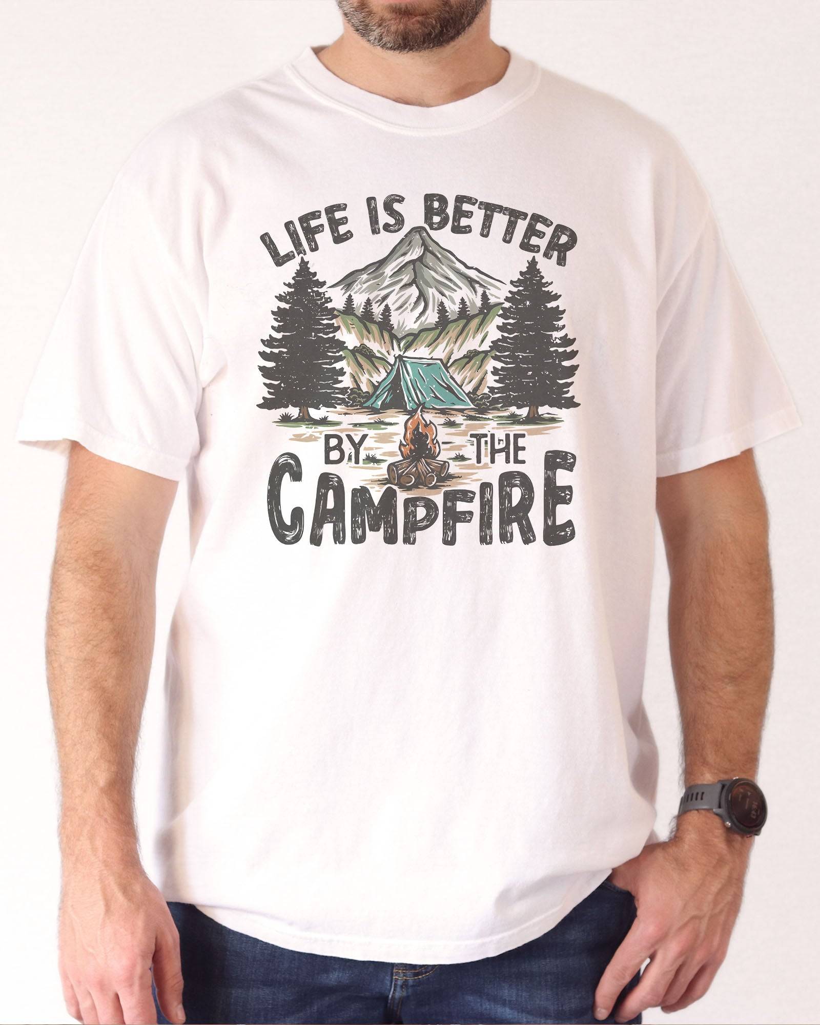 Man wearing 'Life Is Better By The Campfire' shirt in white color and with  retro camping nature graphic