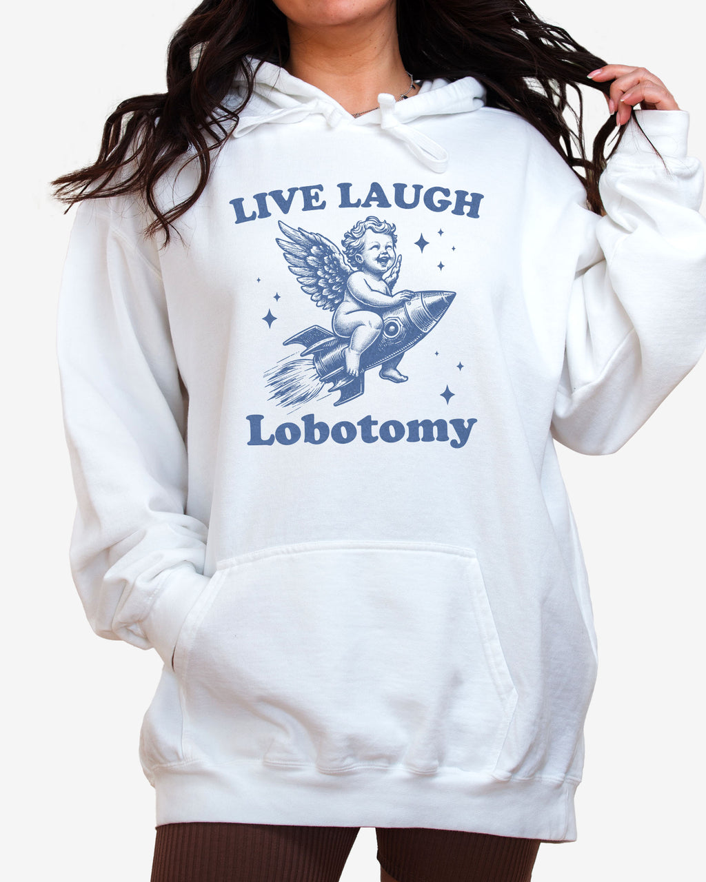 Woman wearing white 'Live Laugh Lobotomy' hoodies with funny retro graphic of armor flying on a rocket.