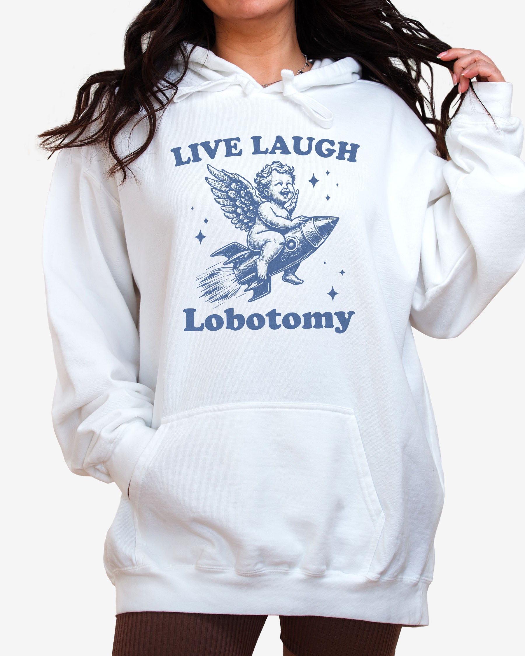 Woman wearing white 'Live Laugh Lobotomy' hoodies with funny retro graphic of armor flying on a rocket.
