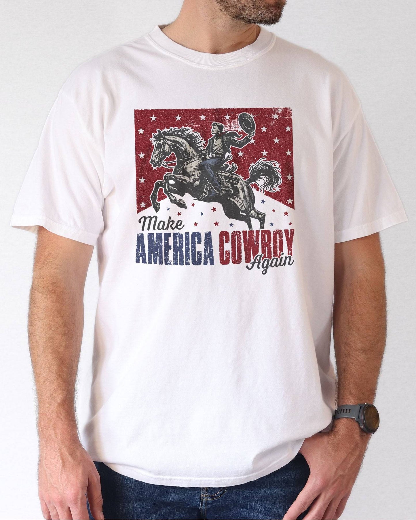 Model wearing white color shirt with 'Make America Cowboy Again' graphic design