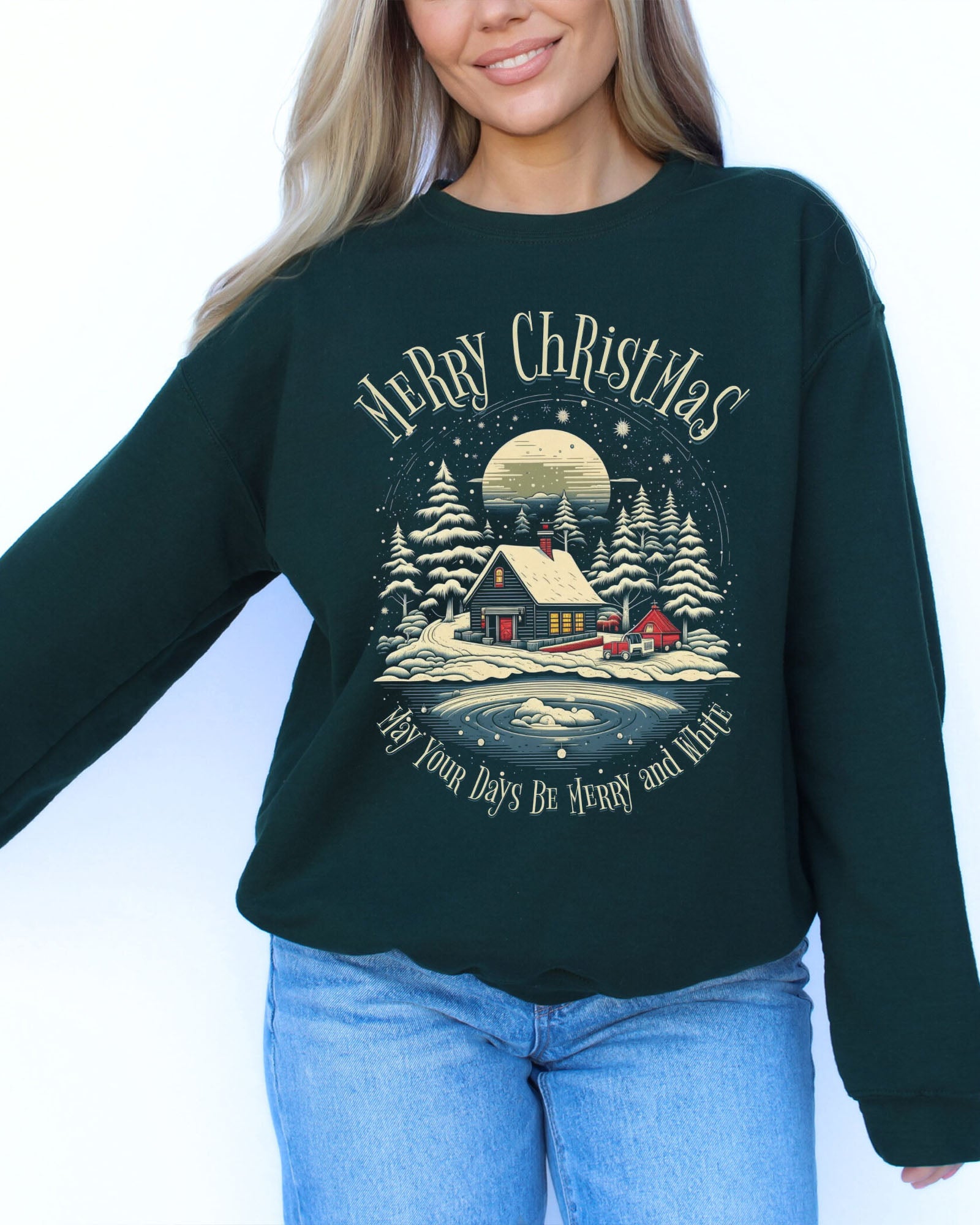 Model wearing forest green color sweatshirt with 'May Your Days Be Merry And Bright' Christmas graphic design