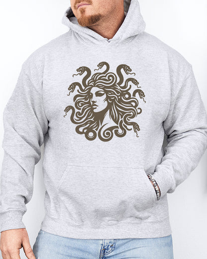 Man wearing an ash gray hoodie featuring a vintage-style Medusa graphic with snake hair.