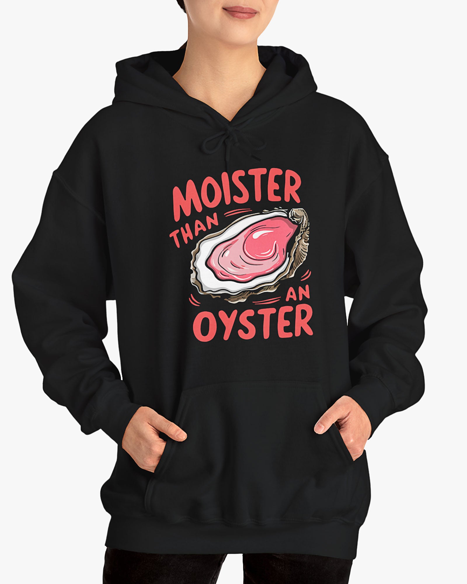 Woman wearing a black 'Moister Than An Oyster' hoodie featuring a funny oyster graphic.