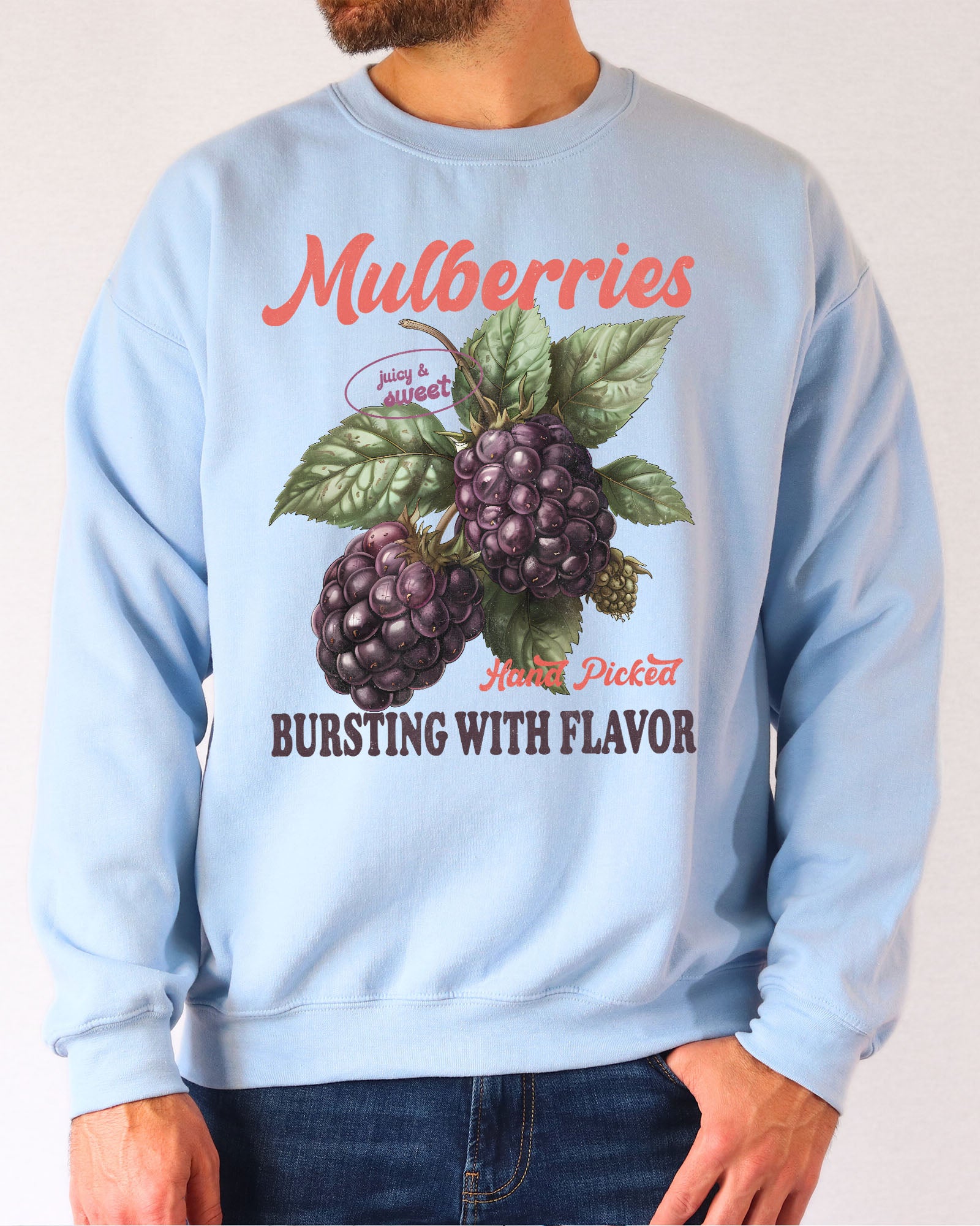 Model wearing light blue color sweatshirt with mulberries fruit graphic design