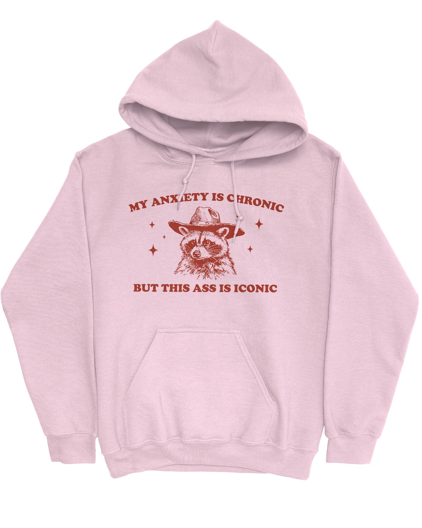 Flat lay of a light pink 'My Anxiety Is Chronic But This Ass Is Iconic' hoodie featuring a funny retro cowboy raccoon graphic.