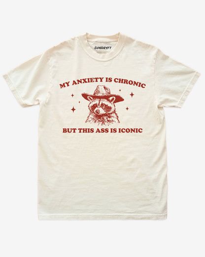 My Anxiety Is Chronic But This Ass Is Iconic shirt in ivory with funny cowboy raccoon graphic