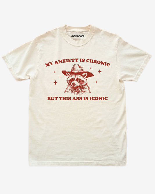 My Anxiety Is Chronic But This Ass Is Iconic shirt in ivory with funny cowboy raccoon graphic