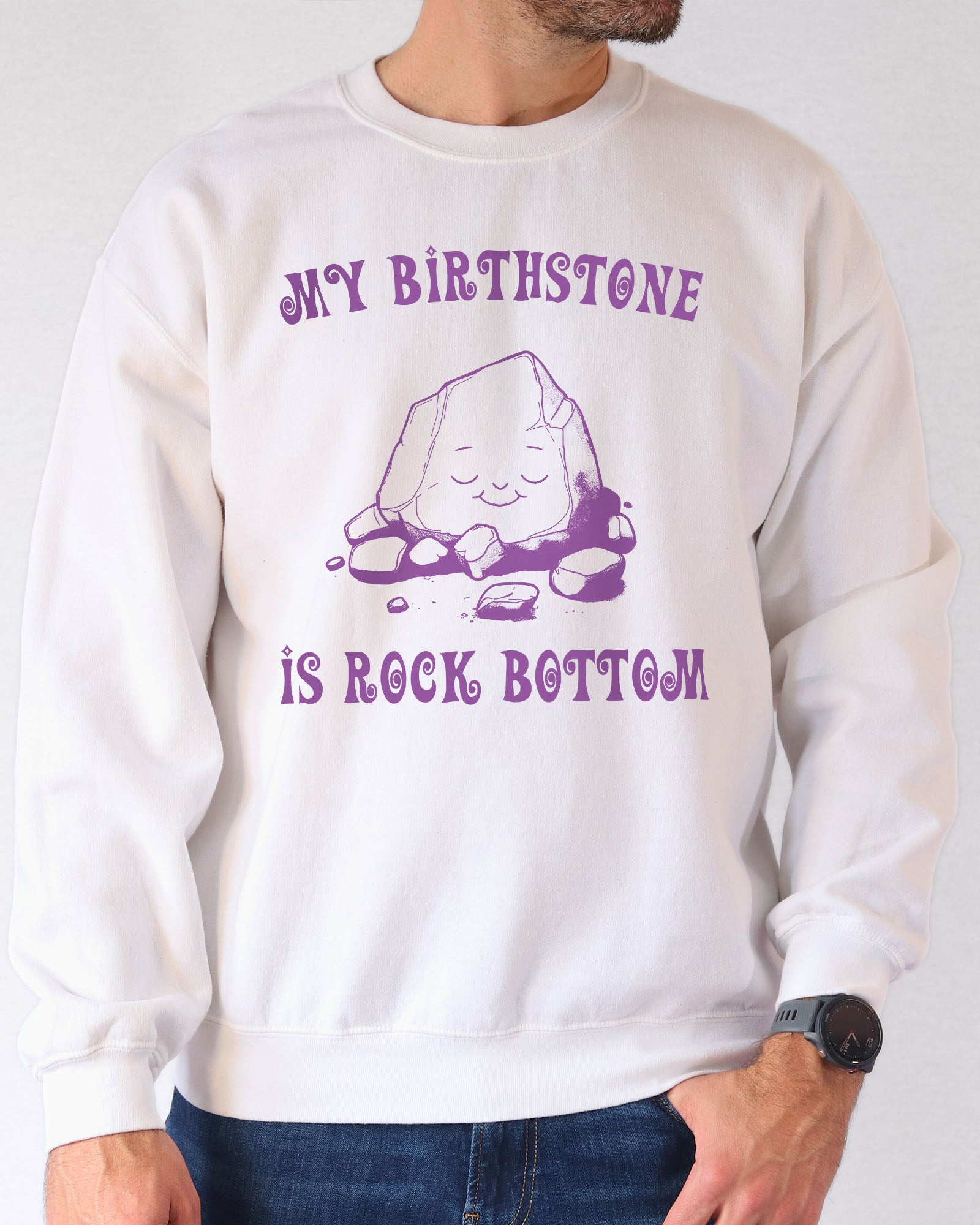 Model wearing white color sweatshirt with 'My Birthstone Is Rock Bottom' graphic design