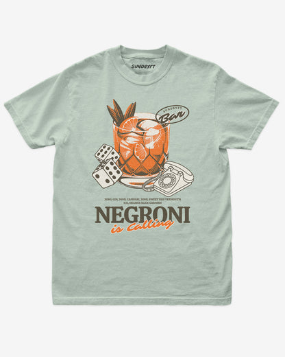 Negroni Is Calling shirt in bay color with retro graphic of negroni drink and telephone