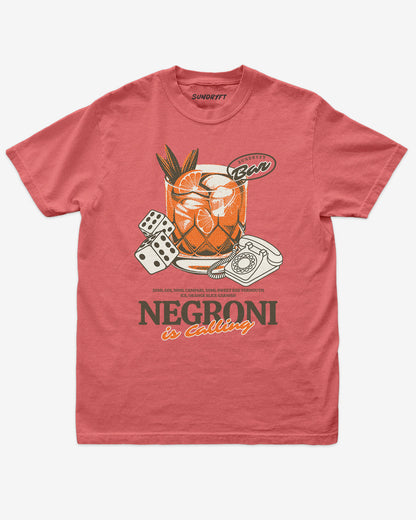 Negroni Is Calling shirt in watermelon color with retro graphic of negroni drink and telephone