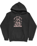 Flat lay a black 'Not My Trash, Not My Dumpster' hoodie with a funny retro raccoon drinking coffee graphic.