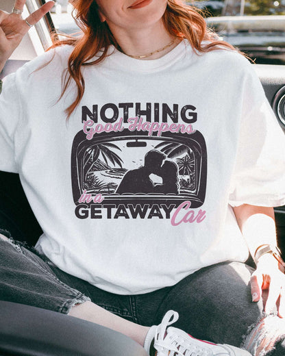 Close-up of model wearing white color shirt with 'Nothing Good Happens In A Getaway Car' graphic design