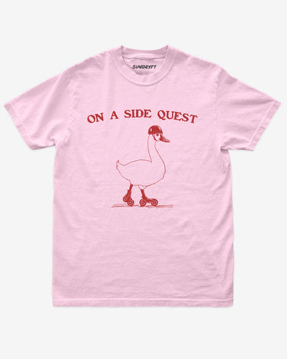 Flat lay of blossom On A Side Quest Shirt, retro 90s vintage graphic tee with funny roller-skating goose design