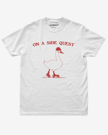 Flat lay of white On A Side Quest Shirt, retro 90s vintage graphic tee with funny roller-skating goose design