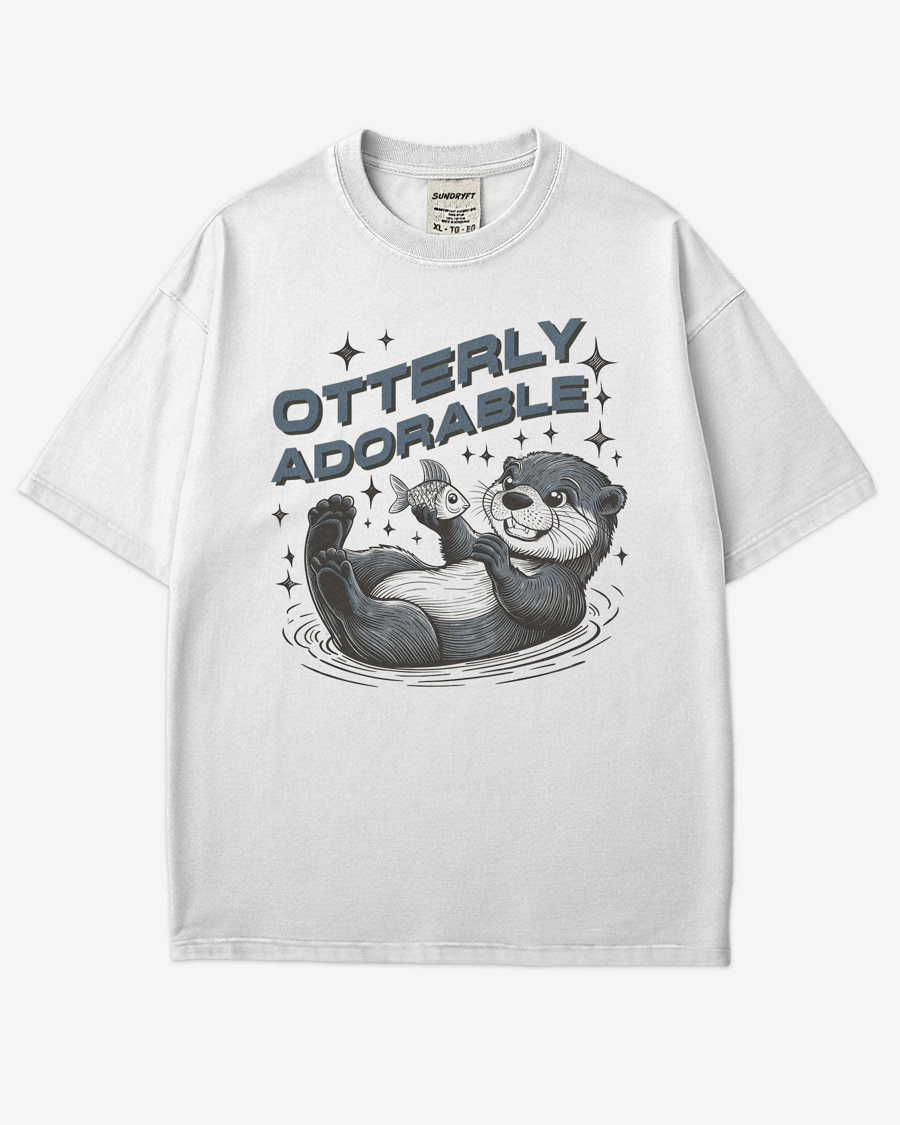 Flat lay white 'Otterly Adorable' shirt with a retro graphic of a happy otter holding a fish.