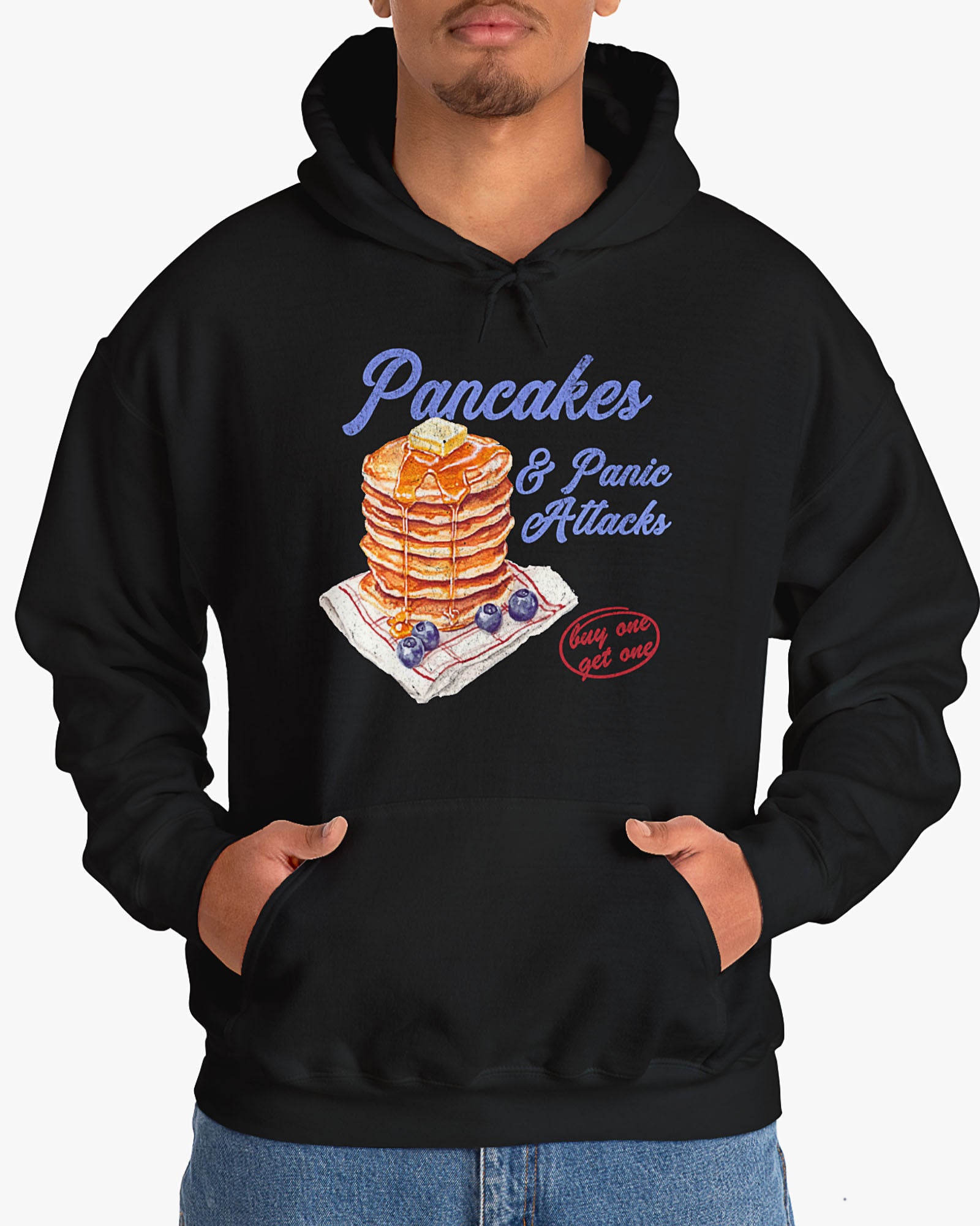 Man wearing black 'Pancakes And Panic Attacks' hoodie with retro distressed pancakes graphic