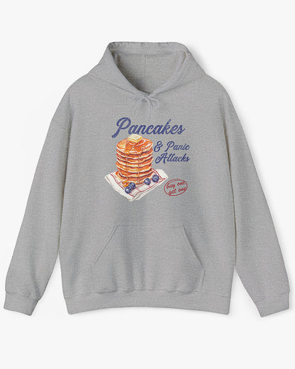 Flat lay sport gray 'Pancakes And Panic Attacks' hoodie with retro distressed pancakes graphic
