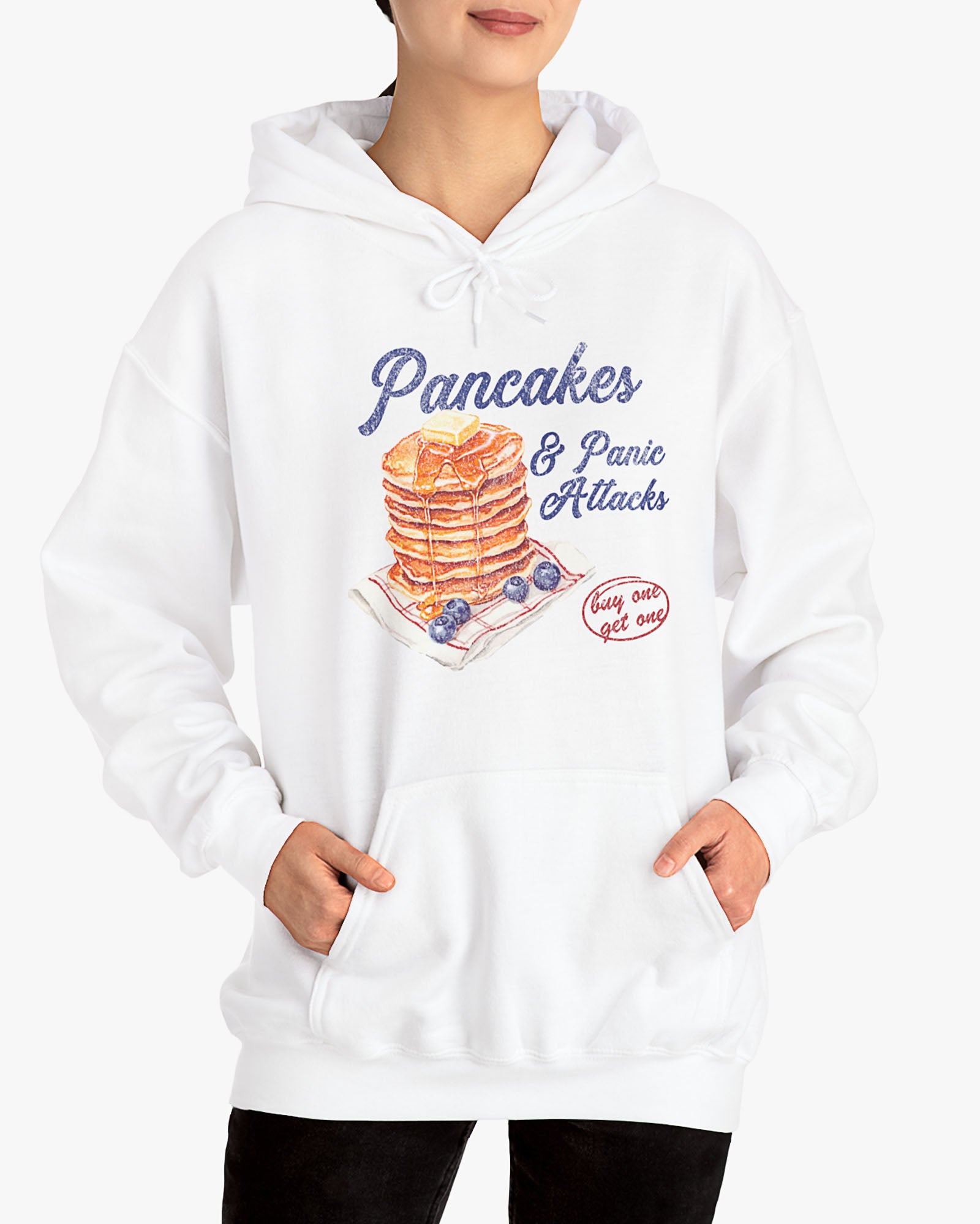 Woman wearing white 'Pancakes And Panic Attacks' hoodie with retro distressed pancakes graphic