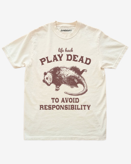 Play Dead To Avoid Responsibility shirt in ivory with funny opossum playing dead graphic
