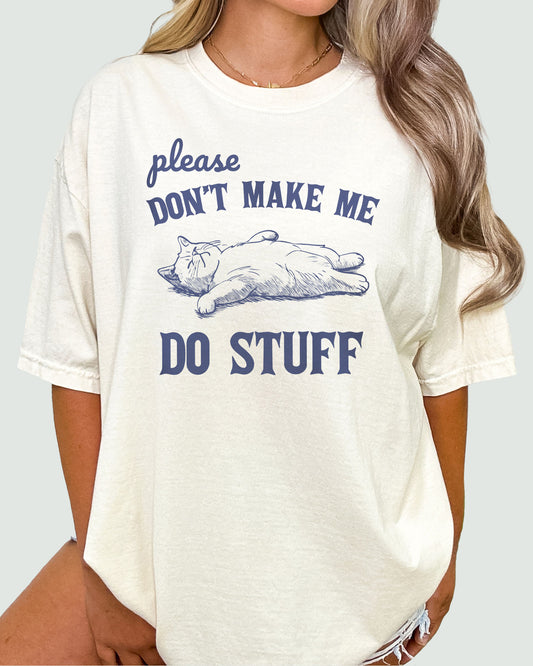 Woman wearing beige shirt with cat retro graphic and funny quote "Please Don't Make Me Do Stuff"