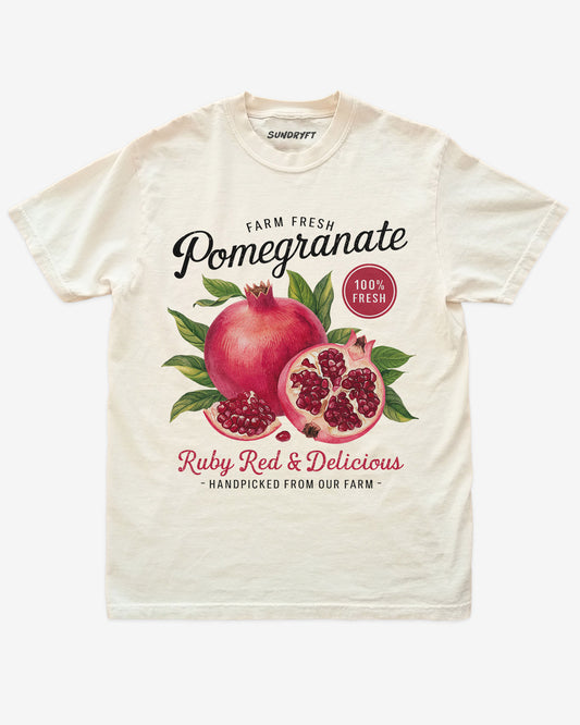 Pomegranate Fruit Shirt flat lay in ivory – retro 90s vintage fruit graphic tee with relaxed unisex fit, soft cotton, and ruby-red pomegranate label design.