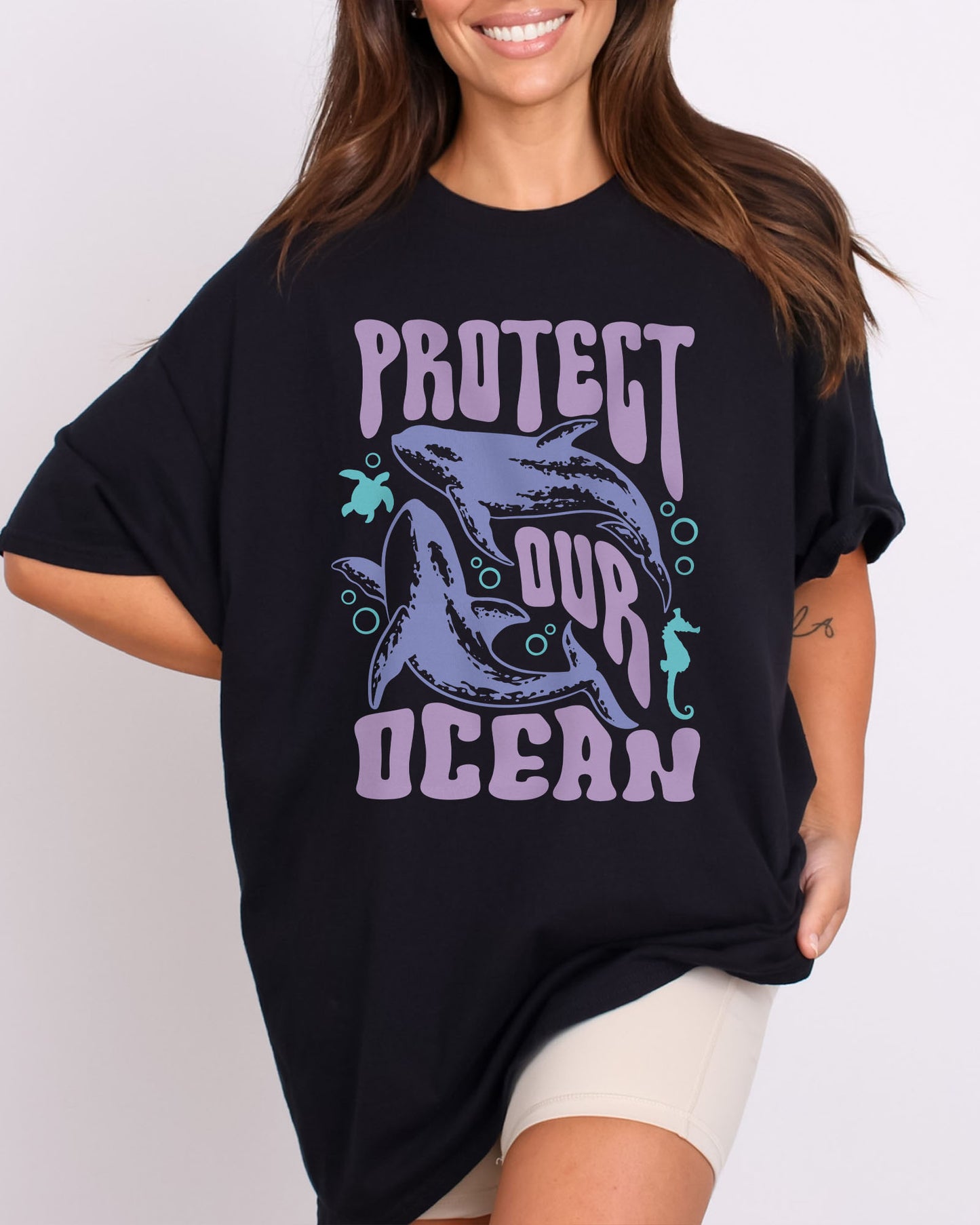 Model wearing black color shirt with 'Protect Our Ocean' retro graphic design