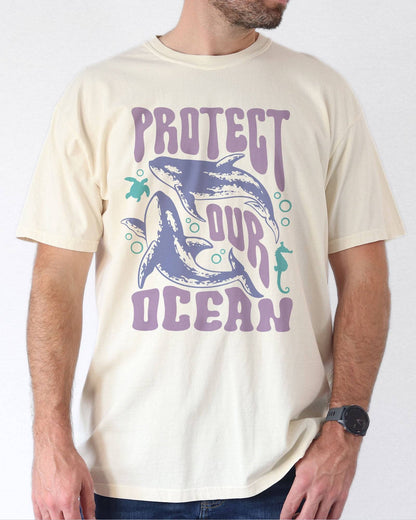 Model wearing natural color shirt with 'Protect Our Ocean' retro graphic design