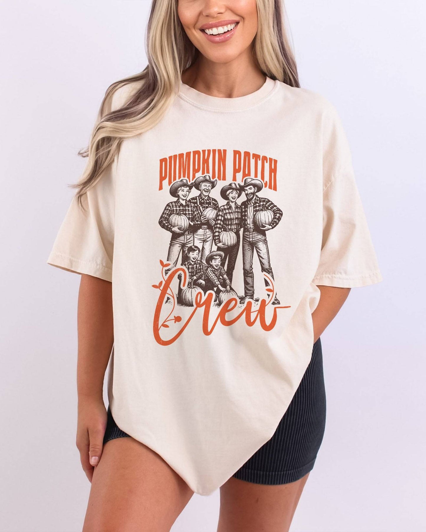 Model wearing ivory color shirt with 'Pumpkin Patch Crew' graphic design