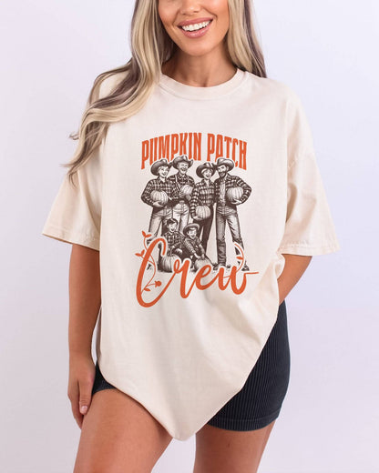 Model wearing ivory color shirt with 'Pumpkin Patch Crew' graphic design