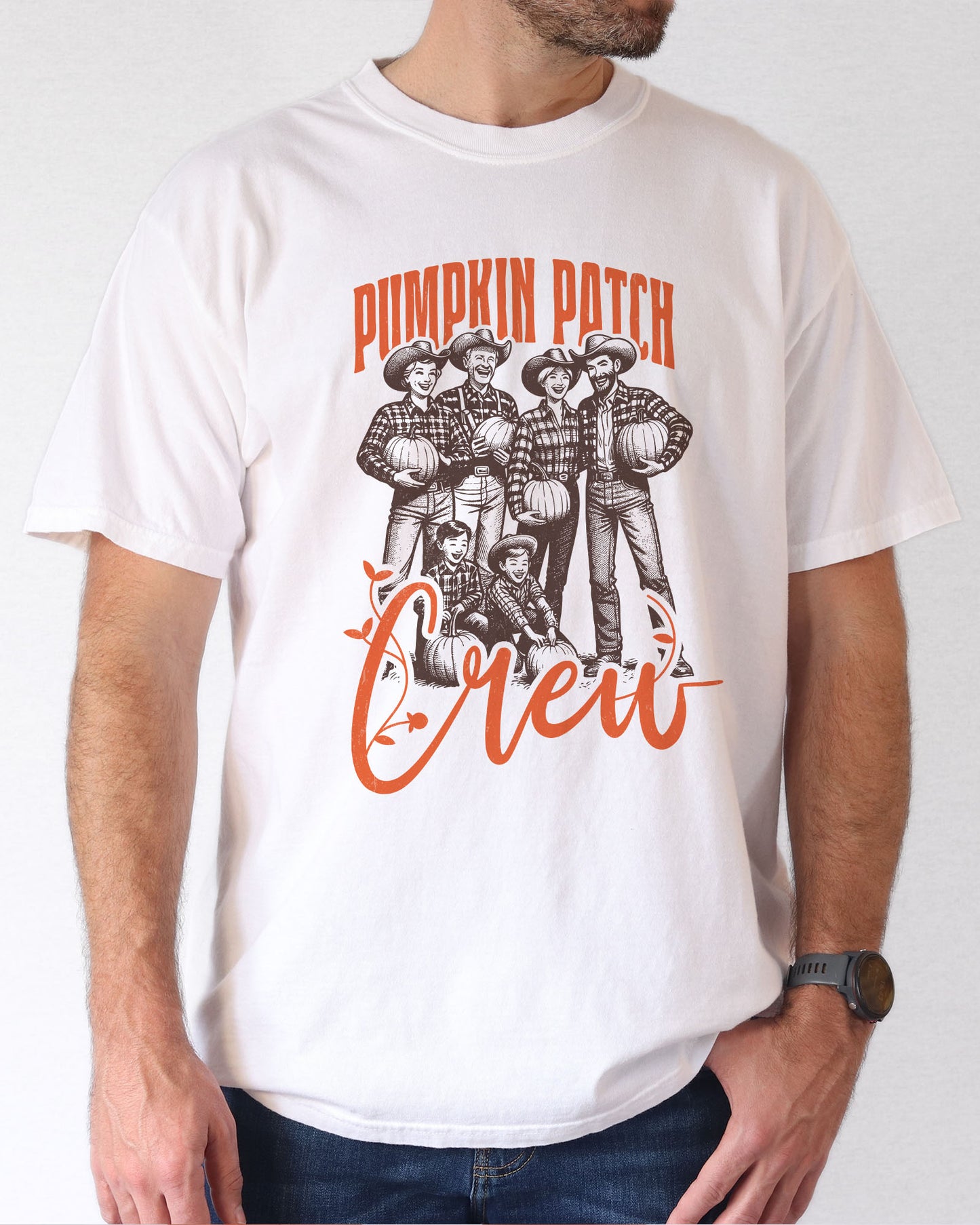 Model wearing white color shirt with 'Pumpkin Patch Crew' graphic design